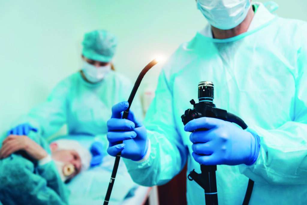 Endoscopy at the hospital. Doctor holding endoscope before gastroscopy
